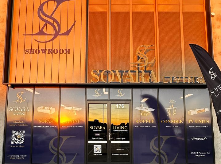 Exterior view of Sovara Living showroom featuring luxury furniture signage and large glass windows.