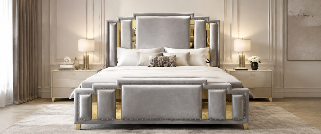 Luxury grey velvet upholstered bed with gold accents in a modern bedroom setting.