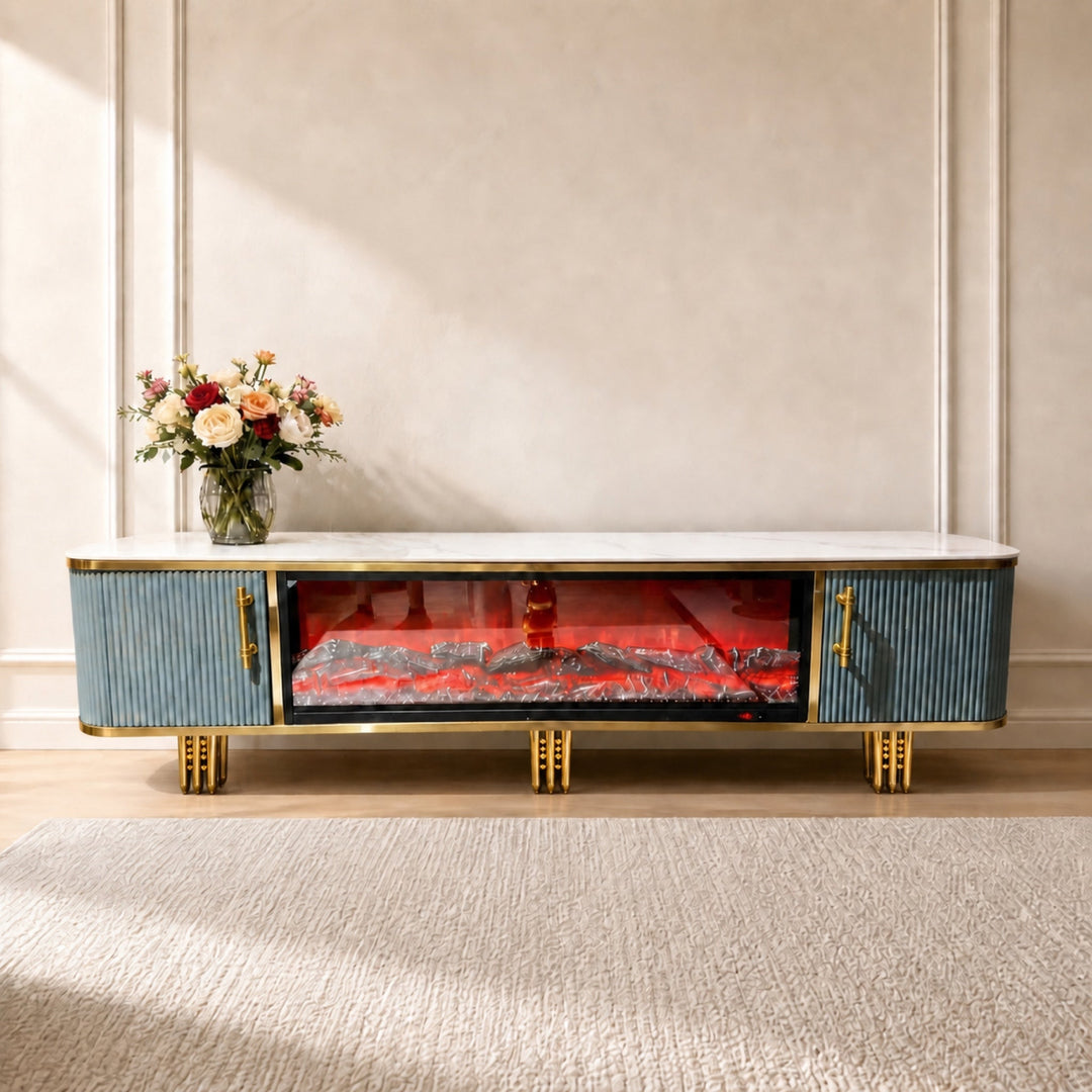 Blue and gold Liora Fireplace TV Unit with fluted doors and decorative gold legs, front view