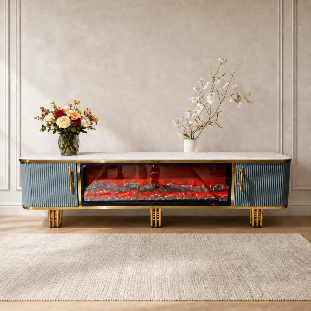 Blue and gold Liora Fireplace TV Unit styled with flowers in a warm neutral living room