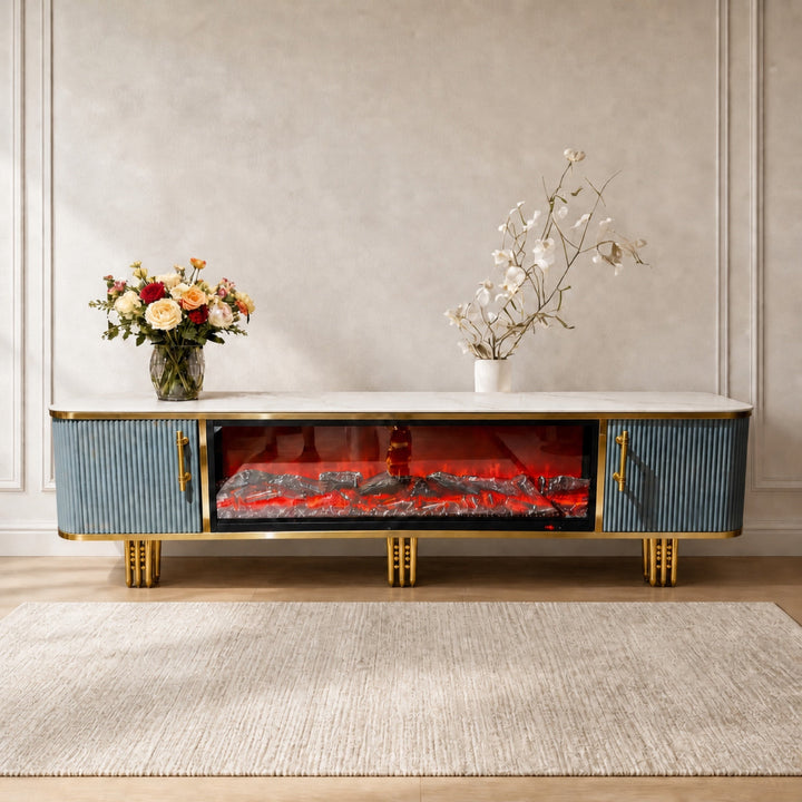 Blue and gold Liora Fireplace TV Unit styled with flowers in a warm neutral living room