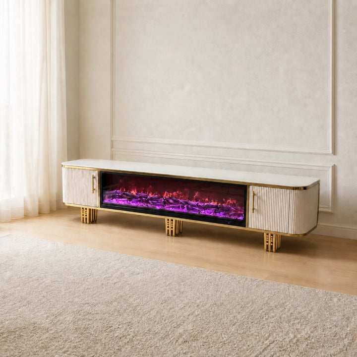 White and gold Liora Fireplace TV Unit in a warm neutral living room, three-quarter view