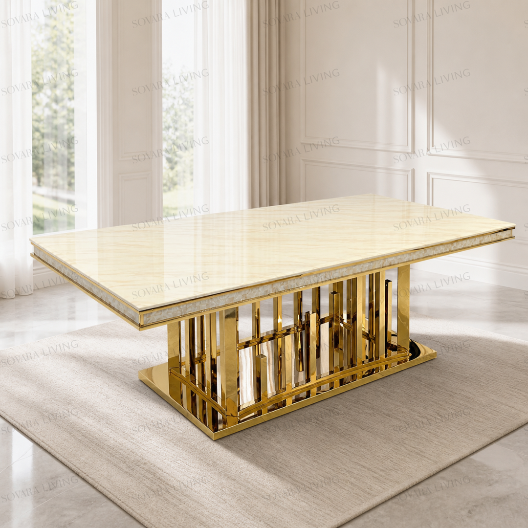 Solena rectangular dining table with a warm cream patterned top and mirror-gold architectural pedestal base