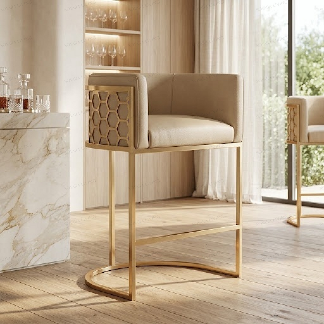 Vesper beige and gold geometric bar stool with upholstered seat and gold-tone honeycomb frame in luxury kitchen