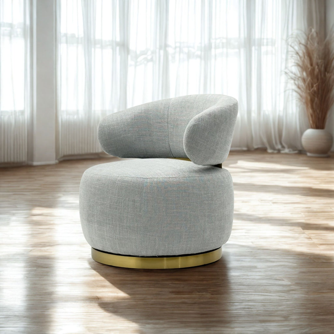 Virella swivel accent chair in grey fabric with brushed gold base - angled side view